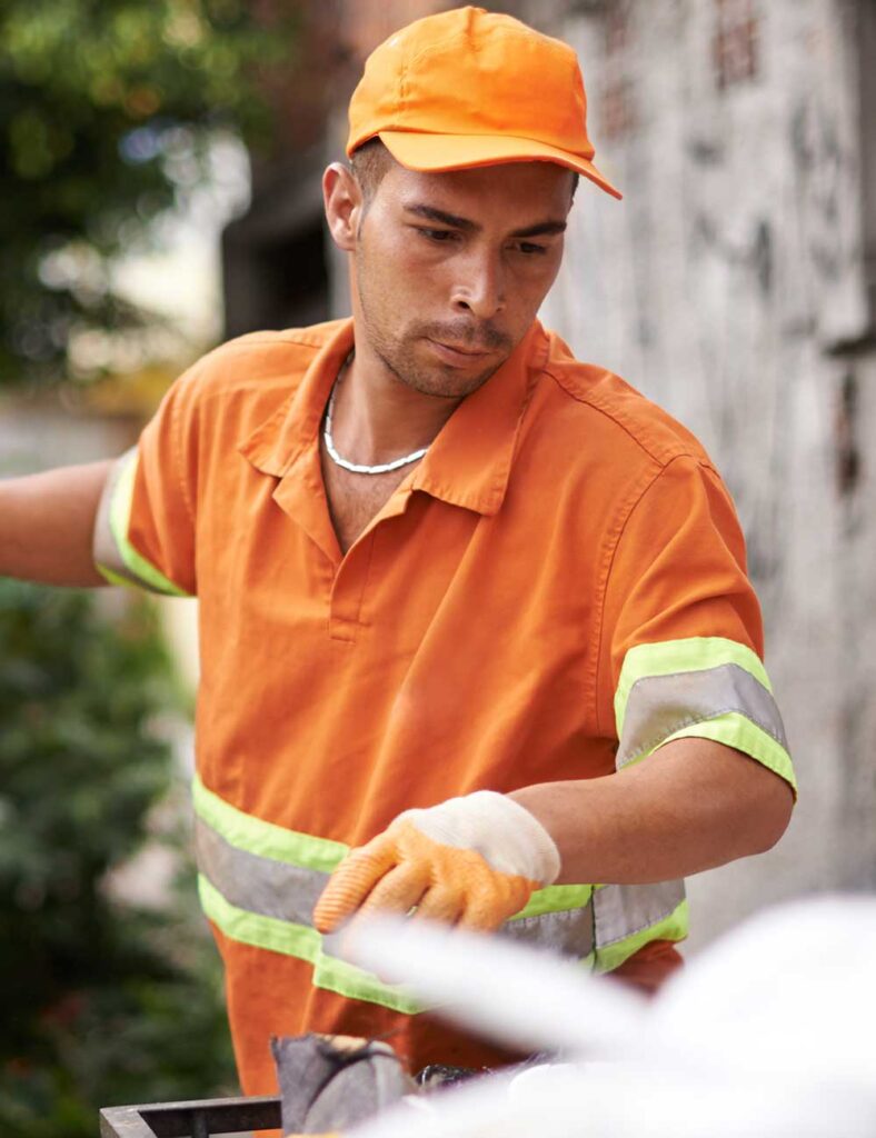 a man wearing an orange hat and gloves